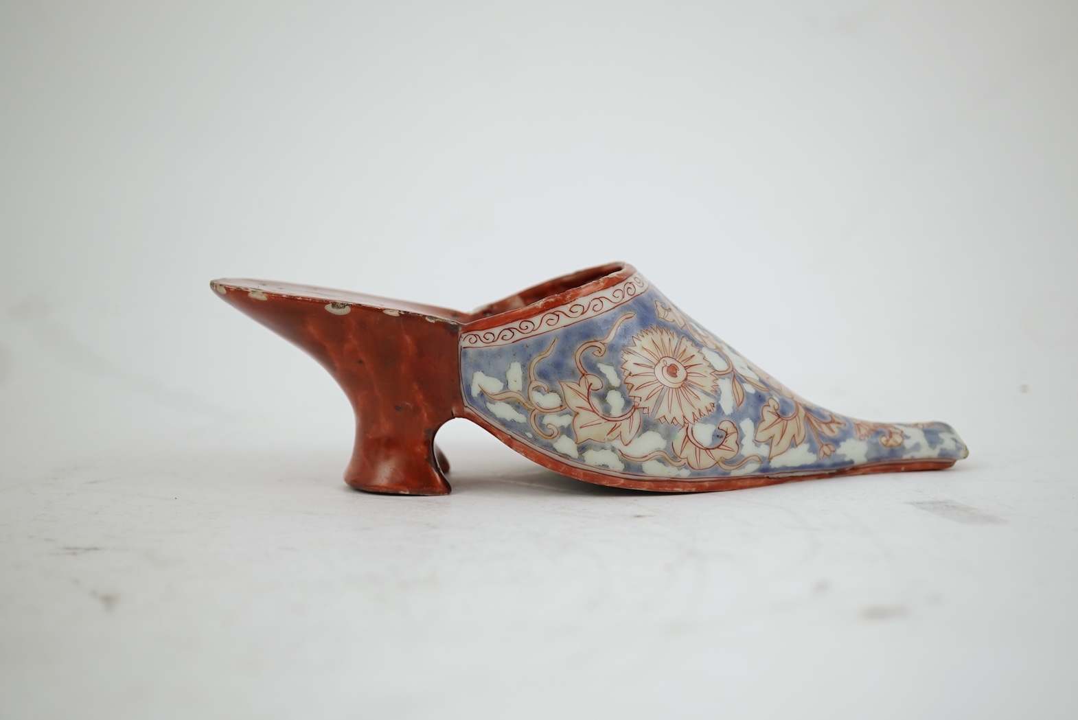 A rare Japanese Arita or Chinese porcelain model of a shoe, based on a Delft shape, first half of 18th century